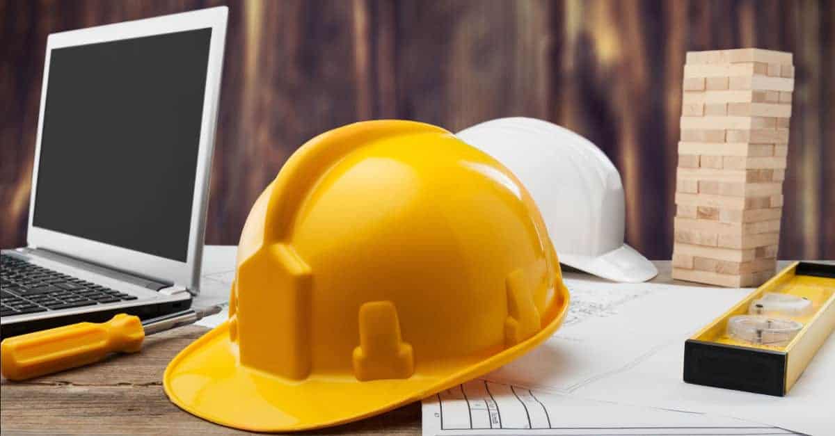 General Contractor Hard Hat on desk among other items