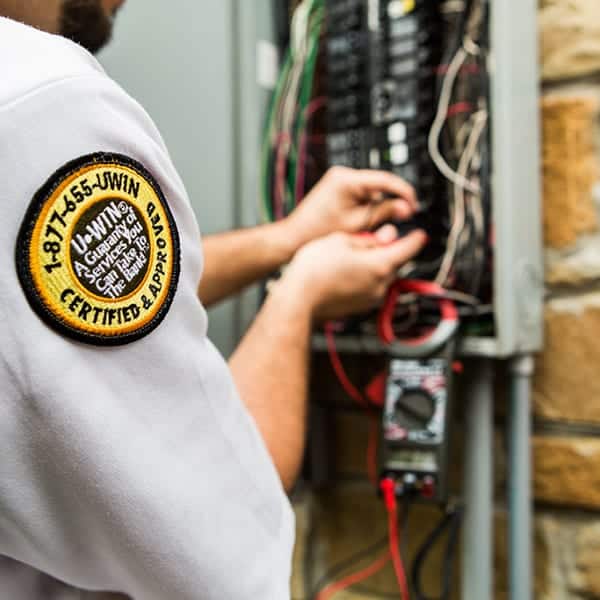 Mister Sparky Electrician Tulsa working on an electrical panel repair