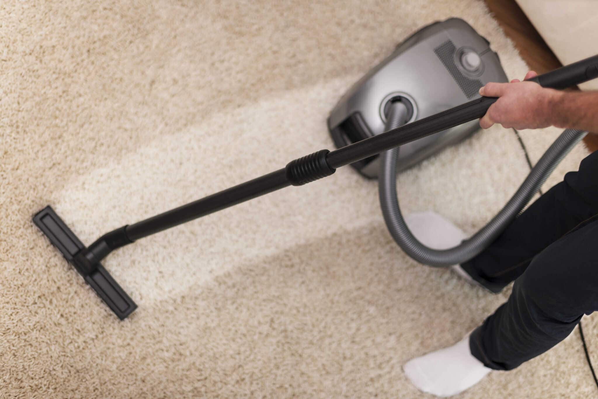 Carpet Cleaning. Carpet cleaner cleaning dirty carpet
