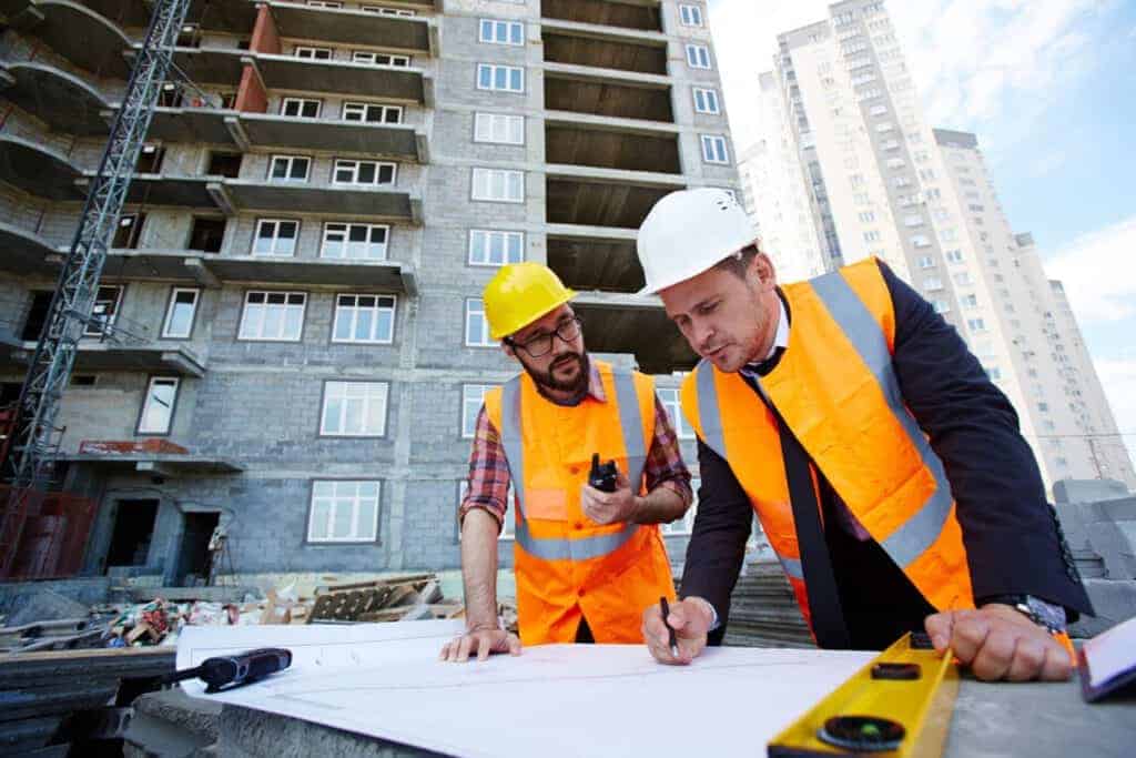 Contractors looking over building plans