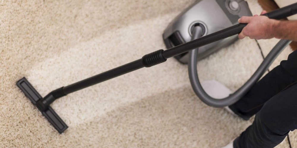 Carpet Cleaning. Carpet cleaner cleaning dirty carpet