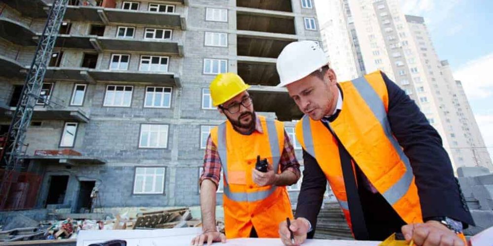 Contractors looking over building plans