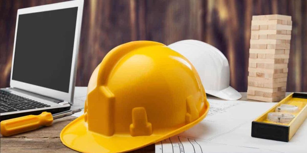 General Contractor Hard Hat on desk among other items