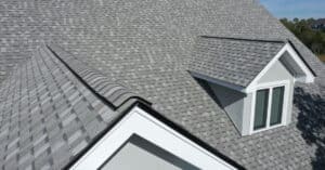 Make roofing last with quality material. Home with good shingles on roof.