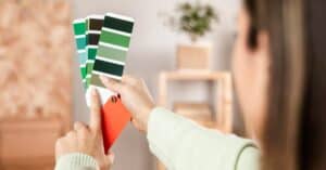 Woman picking paint from swatches